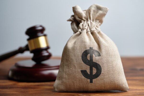 Dollar Bag and Judge's Gavel in Background