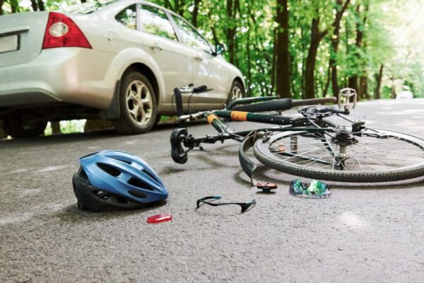 Bicycle accident with car on a road